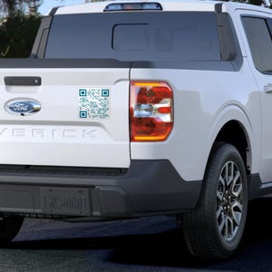 May include: White Ford Maverick pickup truck with a black rear bumper and a blue and white QR code sticker on the tailgate.