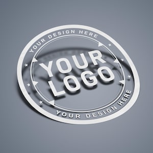 May include: White circle sticker with the text "YOUR DESIGN HERE" around the edge and "YOUR LOGO" in the center.