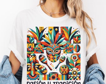 May include: White t-shirt with a colorful graphic design featuring a mask, maracas, and other geometric shapes. The text "Pasión y Tradición" is printed below the graphic.