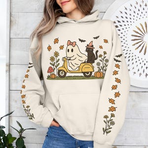 Ghost Cat Scooter Halloween Hoodie, Spooky Cute Autumn Pullover, Flying Bats & Flowers Top, Whimsical Holiday Apparel, Trick or Treat Gift