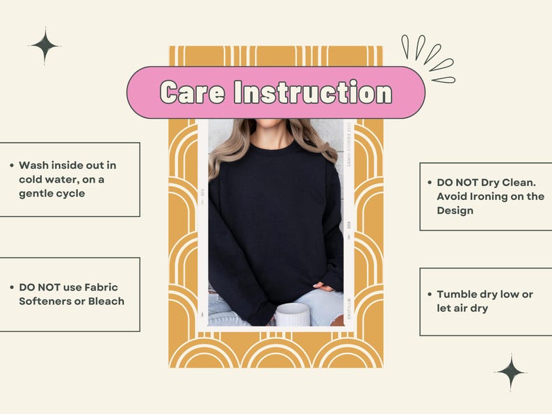 May include: A navy blue sweatshirt with care instructions. The text on the image says to wash inside out in cold water on a gentle cycle, do not dry clean, avoid ironing on the design, do not use fabric softeners or bleach, and tumble dry low or let air dry.