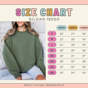 Pode incluir: Uma camisola unissexo para adultos verde-oliva &eacute; mostrada com uma tabela de tamanhos. A tabela lista os tamanhos S a 5XL, com medidas de largura, comprimento e comprimento da manga em cent&iacute;metros. A camisola &eacute; da Gildan, estilo 18000.