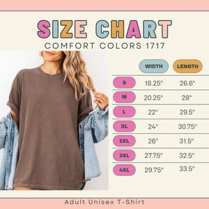 May include: Size chart for Comfort Colors 1717 adult unisex t-shirts. Measurements are provided in inches for width and length, ranging from size S to 4XL. The image shows a woman wearing a brown t-shirt.