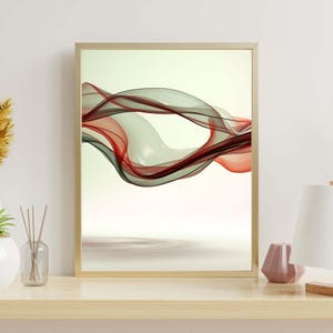 Peut inclure: Une impression d'art mural rectangulaire dans un cadre doré fin présentant une composition abstraite de rubans translucides et fluides dans des tons rouge profond, vert foncé et crème, créant un mouvement fluide sur un fond clair.