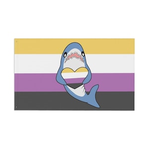 May include: A rectangular flag featuring the non-binary pride flag design with a cartoon shark illustration. The shark is blue with a heart-shaped cutout and open mouth. The flag has horizontal stripes of yellow, white, purple, gray, and black.