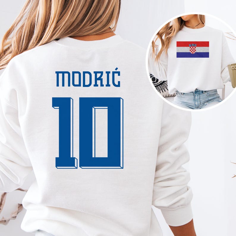 A white sweatshirt with the number 10 and the name "MODRIC" printed on it, along with a small image of the national flag of Croatia.