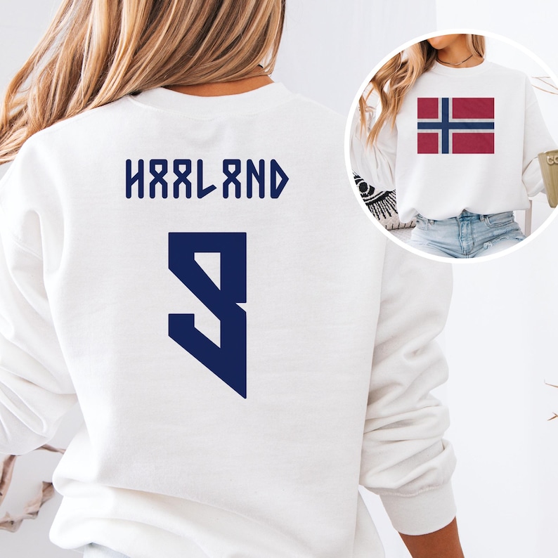 A white sweatshirt with the text "HÄRLAND" and the number "9" printed on it, along with a graphic of the Norwegian flag.