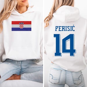A white hoodie with a Croatia flag and the number 14 printed on the back.