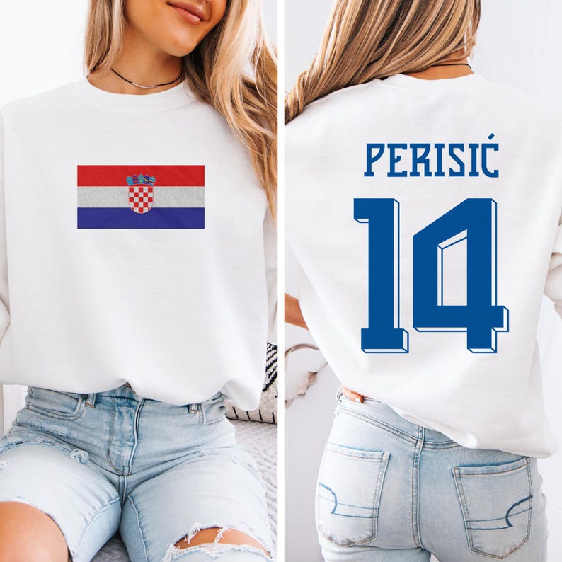 A woman wearing a white sweatshirt with a Croatia national flag and the number 14 on the back.