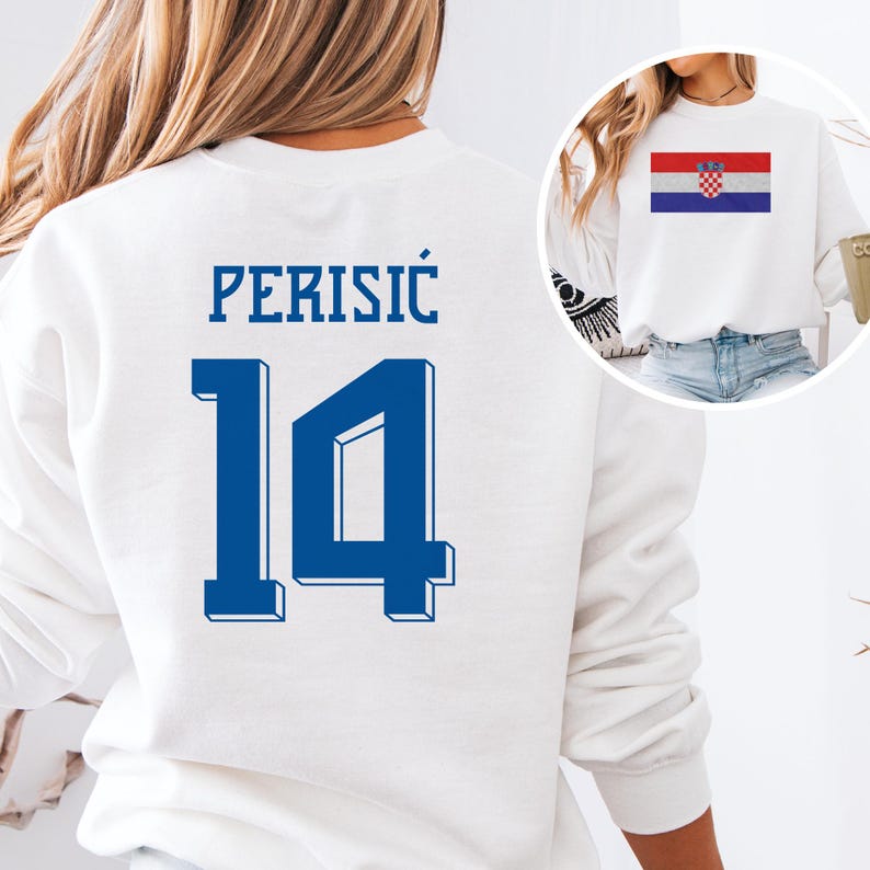 A white sweatshirt with the number 14 and the name "PERISIC" printed on it, along with a small image of the Croatia national flag.