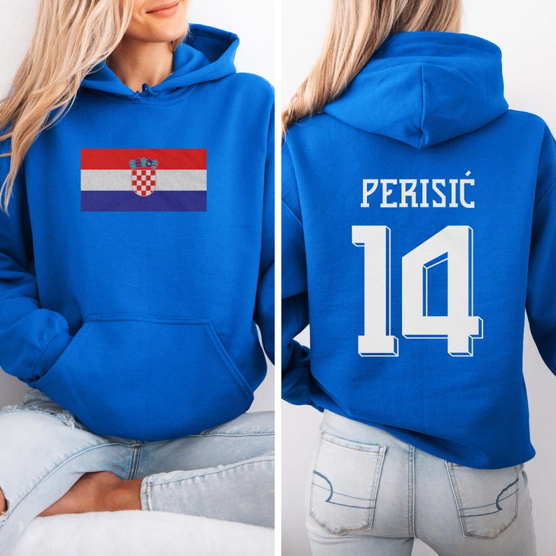 A woman wearing a blue hoodie with the Croatia national flag and the number 14 on the back.