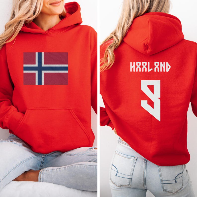 A woman wearing a red hoodie with the flag of Norway and the number 9 on the back.