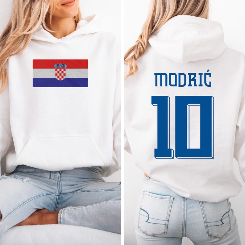 A woman wearing a white hoodie with the Croatia national flag and the number 10 on the back.
