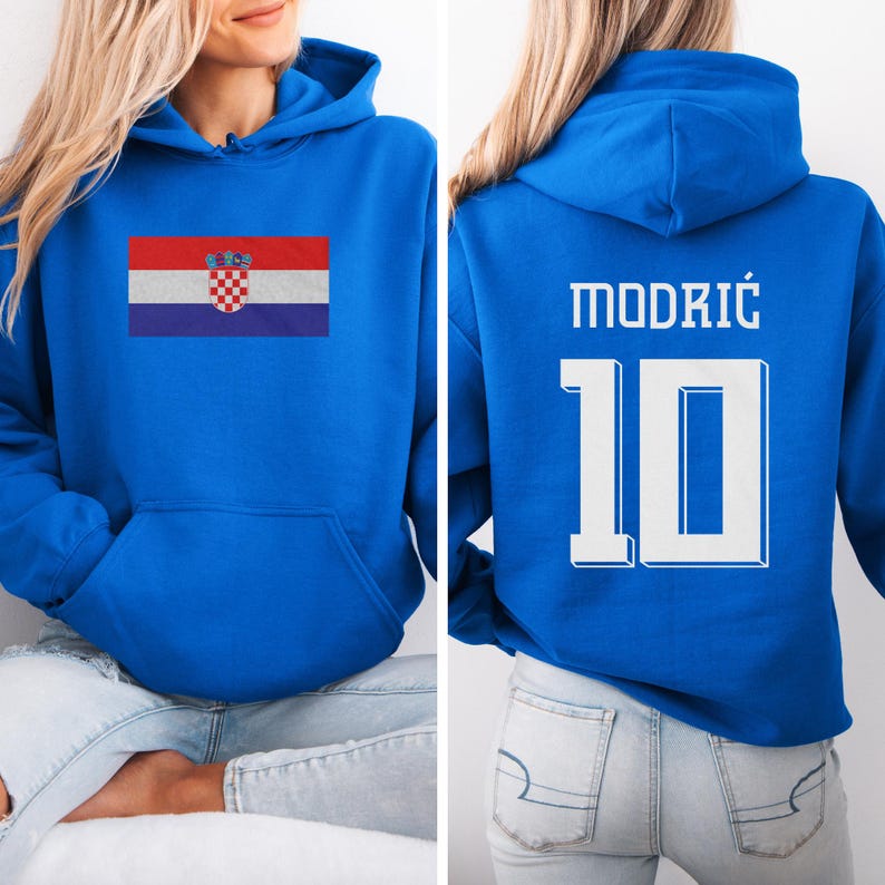 A woman wearing a blue hoodie with the Croatia national flag and the number 10 on the back.