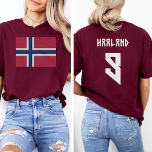 A woman wearing a burgundy t-shirt with the flag of Norway and the number 9 printed on it.