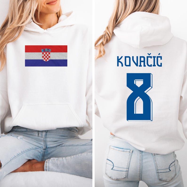A woman wearing a white hoodie with the Croatia national flag and the number 8 on the back.