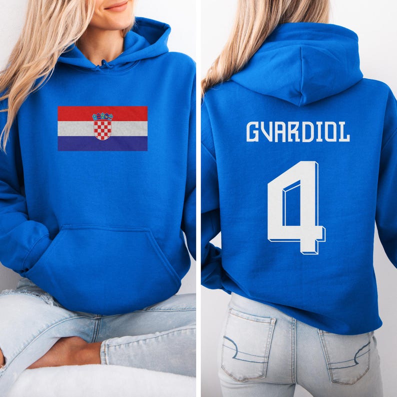 A woman wearing a blue hoodie with the Croatia national flag and the number 4 on the back.