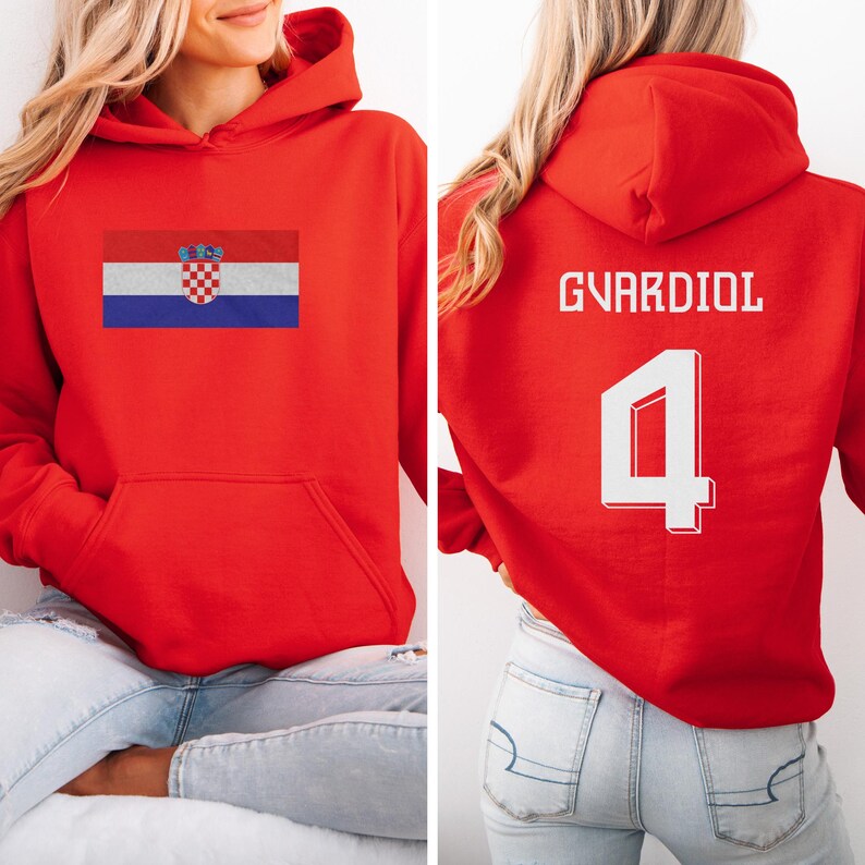 A woman wearing a red hoodie with the Croatia national flag and the number 4 on the back.