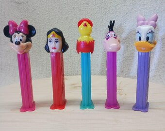Five vintage collectible pez dispensers