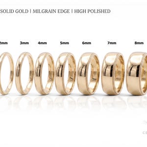 Può includere: Una collezione di fedi nuziali in oro, con larghezze da 2 mm a 8 mm, con bordi milgrain e finitura lucida. Il testo nell'immagine recita "10K SOLID GOLD | MILGRAIN EDGE | HIGH POLISHED".
