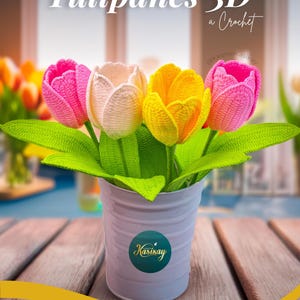 May include: A handmade crochet flower arrangement featuring four colorful tulips in a white metal pot. The tulips are pink, cream, and yellow, with green leaves. The image includes text that reads "PATR&Oacute;N Tulipanes 3D a Crochet".