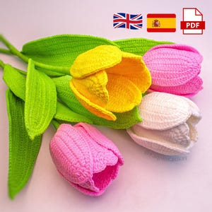 May include: A bouquet of crocheted tulips in shades of yellow, pink, and white, with green leaves. The handmade flowers are arranged on a light pink surface. The image includes a PDF icon and flags of the UK and Spain.