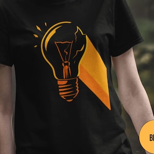 Funny Broken Light Bulb Unisex T-Shirt, Bad Idea Graphic Tee, Idea Symbol Shirt, Creative Illumination Top, Lightbulb Humor Apparel