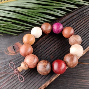 May include: A set of three ceramic mugs with a speckled, matte finish in cream, light brown, and dark brown. Each mug has a simple, minimalist design and a rounded handle.