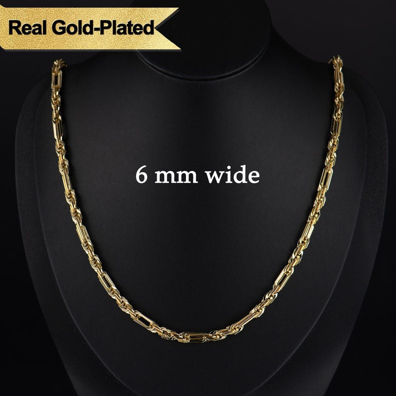 May include: A gold-plated necklace, 6 mm wide, displayed on a black mannequin. The necklace has a rectangular link design. The text "Real Gold-Plated" is in a gold banner at the top.