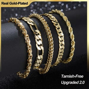 May include: Five gold-plated bracelets with different chain designs are displayed against a black background. The bracelets include a Byzantine, curb, rope, and other link styles. The image includes the text "Real Gold-Plated" and "Tarnish-Free Upgraded 2.0".