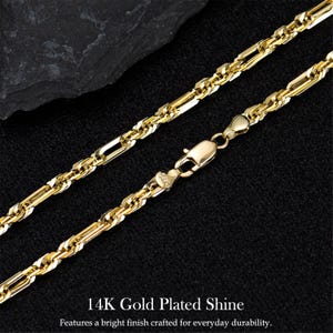 May include: A gold-plated necklace with a bright finish. The necklace features a combination of rectangular and rope-like links, with a secure clasp. The text "14K Gold Plated Shine" is visible at the bottom of the image.