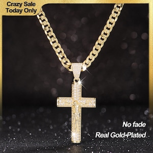 May include: Gold-plated cross pendant necklace with a cuban link chain. The cross is encrusted with small, clear stones and features a detailed depiction of Jesus. The image includes the text "No fade" and "Real Gold-Plated".