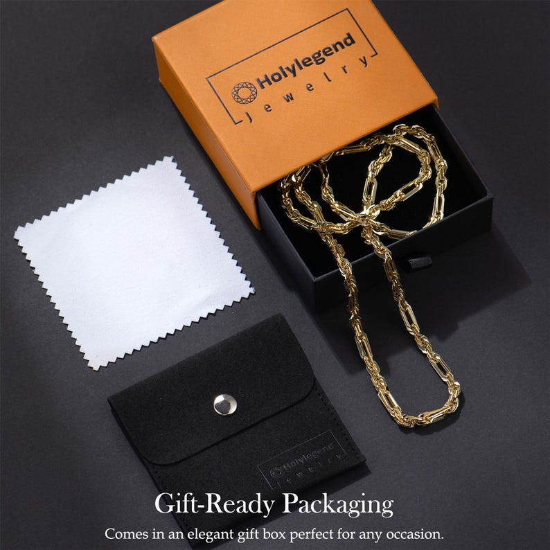 May include: A gold-colored chain necklace displayed in an open orange and black gift box. The box is labeled "Holylegend Jewelry." A black pouch and a white cleaning cloth are also visible. The text "Gift-Ready Packaging" is at the bottom.