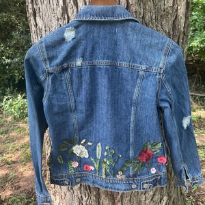 100% cotton Upcycled denim jacket with hand stitched floral aplique