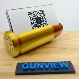 Porta tarjetas de visita con bala de 9 mm