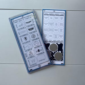 May include: Two white and blue cards featuring racing team logos and bingo squares. One card is in a clear plastic case. The cards have text that reads "PLAY BINGO THROUGHOUT THE 2020 SEASON!" and "SCRATCH HERE AND WIN WHAT'S INSIDE!"