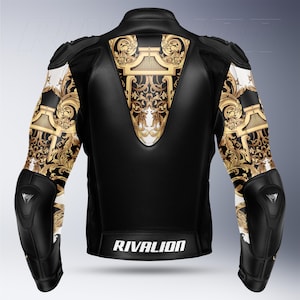 May include: Black motorcycle jacket with gold and white baroque pattern accents. The jacket features protective elbow pads and shoulder detailing. The brand name "RIVALION" is printed in white across the lower back.