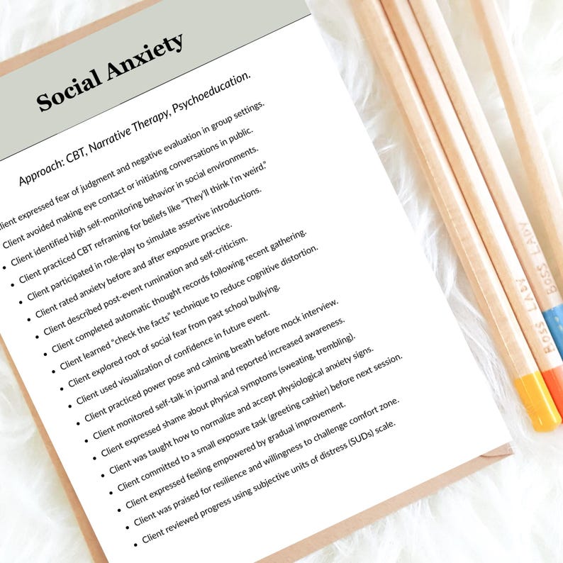 May include: A document titled "Social Anxiety" with bullet points detailing CBT, Narrative Therapy, and Psychoeducation approaches. The document is accompanied by three pencils with the text "BOSS LADY" on them, each with a different coloured eraser.