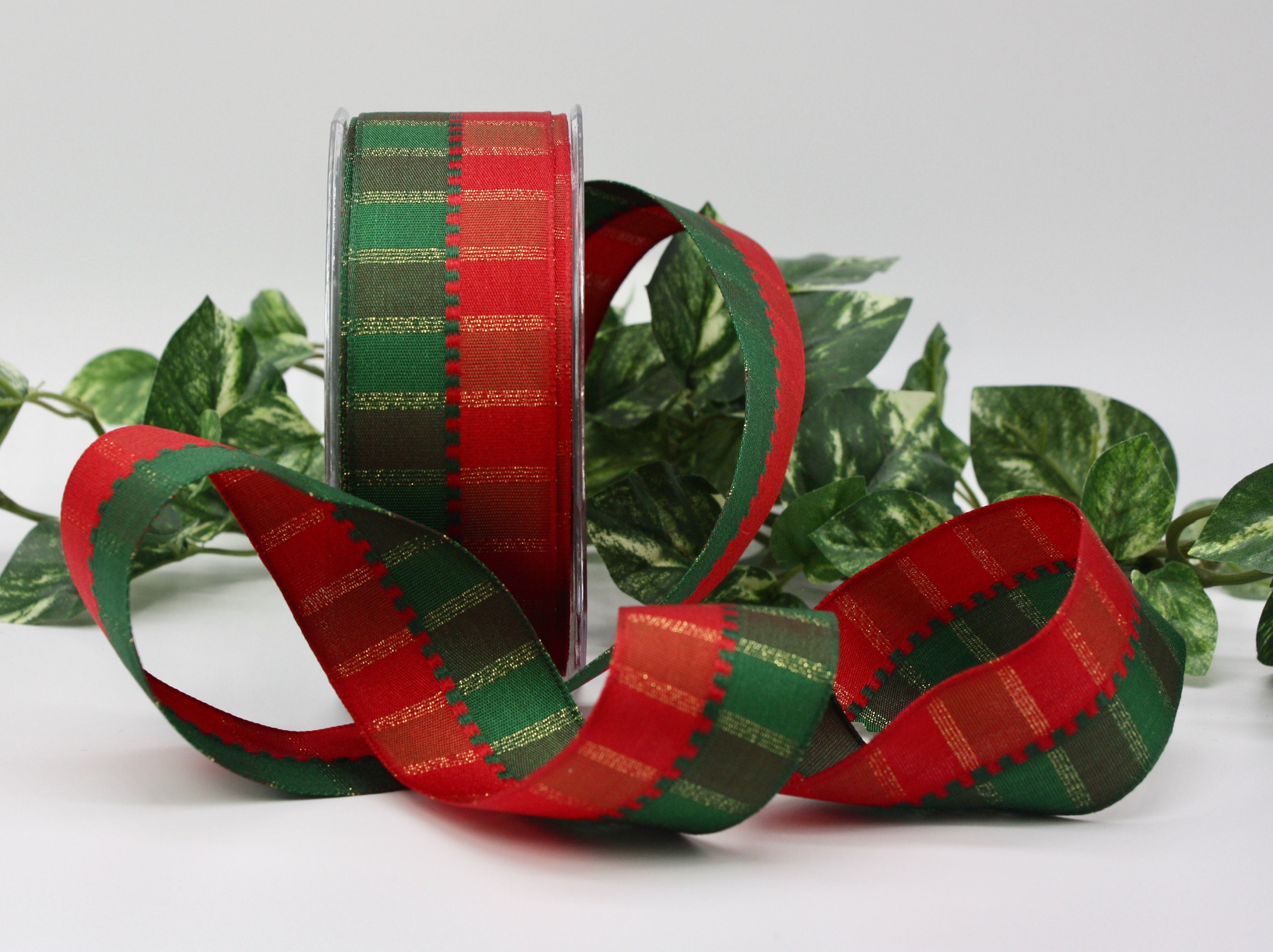 Christmas wrapping ribbon, red with gold lines - Stock