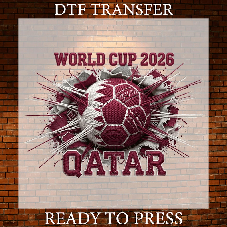 May include: A DTF transfer design featuring a soccer ball in maroon and white, with the text "WORLD CUP 2026 QATAR" in maroon. The design includes a brick wall background and the text "READY TO PRESS".