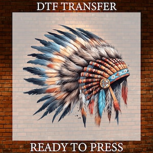 May include: A DTF TRANSFER READY TO PRESS graphic featuring a detailed illustration of a feathered headdress. The design showcases long, layered feathers in shades of blue, brown, and white, accented by a decorative band with geometric patterns.