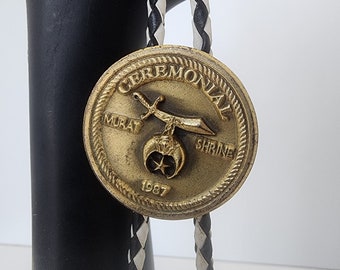 Vintage 1987 CEREMONIAL Shriner Masonic Gold Tone Emblem Medal Bolo Tie with Black & White Cording  Brass Tips Gentleman's Jewelry