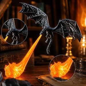 May include: A black dragon figurine in flight with outstretched wings, emitting a long, translucent orange flame effect from its mouth. The dragon has a textured, scaled body and is captured in a dynamic pose with a bright, glowing fire stream.