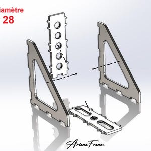 Può includere: Rendering 3D di staffe metalliche argentate e pezzi di collegamento. Il design presenta forme geometriche con fori e fessure. Il testo "Diamètre 28" è in alto a sinistra e la firma "Ariana France" in basso.