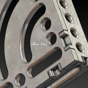 May include: Close-up of a geometric metal design with curved and rectangular cutouts. The design features a textured, light gray surface with dark gray and black accents. The artist's signature, "Ariane France," is visible.