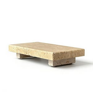 May include: A rectangular beige travertine stone riser with a porous, textured surface. The platform is supported by two thick, matching stone block feet, creating a low-profile stand with a natural, earthy appearance and visible stone grain.
