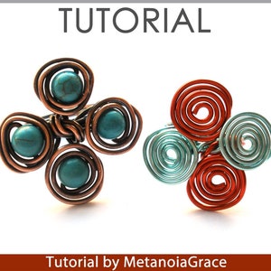 May include: Two wire wrapped rings with turquoise and red stones. The rings are made with copper wire and have a clover shape. The rings are on a white background. Tutorial by MetanoiaGrace.