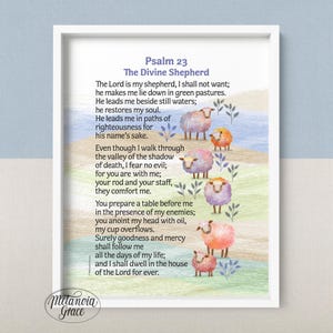 May include: A framed print featuring Psalm 23, "The Divine Shepherd," with colorful illustrations of sheep. The artwork includes text from the Bible verse and a watercolor landscape background. The frame is white.