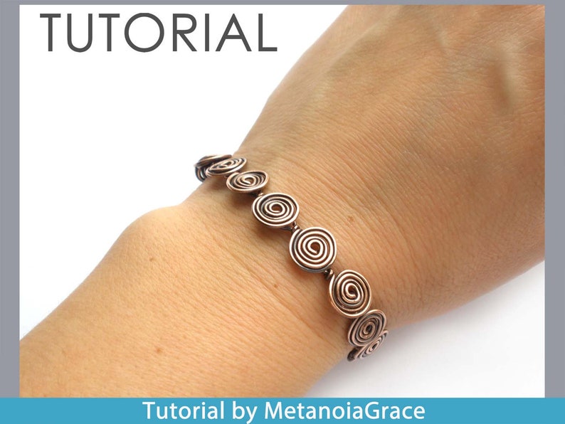 May include: A copper wire bracelet featuring a series of coiled circles. The bracelet is worn on a person's wrist. Tutorial by MetanoiaGrace.