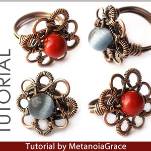 K&ouml;nnte beinhalten: Vier Ringe aus Kupferdraht mit einem Blumenmuster. Jeder Ring hat einen andersfarbigen Stein in der Mitte. Die Steine sind rot, grau, rot und grau. Die Ringe liegen auf einem wei&szlig;en Hintergrund. Tutorial von MetanoiaGrace.